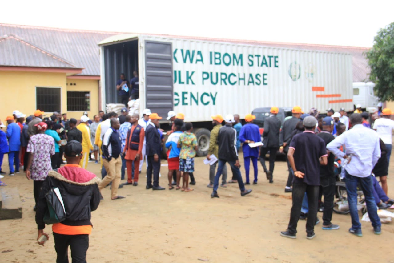Community members gathered around an AKSBPA truck during a distribution exercise